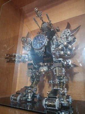 Taurus Robot Watch Stand Holder 3D Assembly Metal Fighting Mecha Action Figure for Clock Collector photo review
