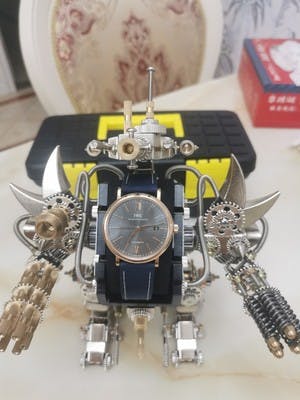 Taurus Robot Watch Stand Holder 3D Assembly Metal Fighting Mecha Action Figure for Clock Collector photo review